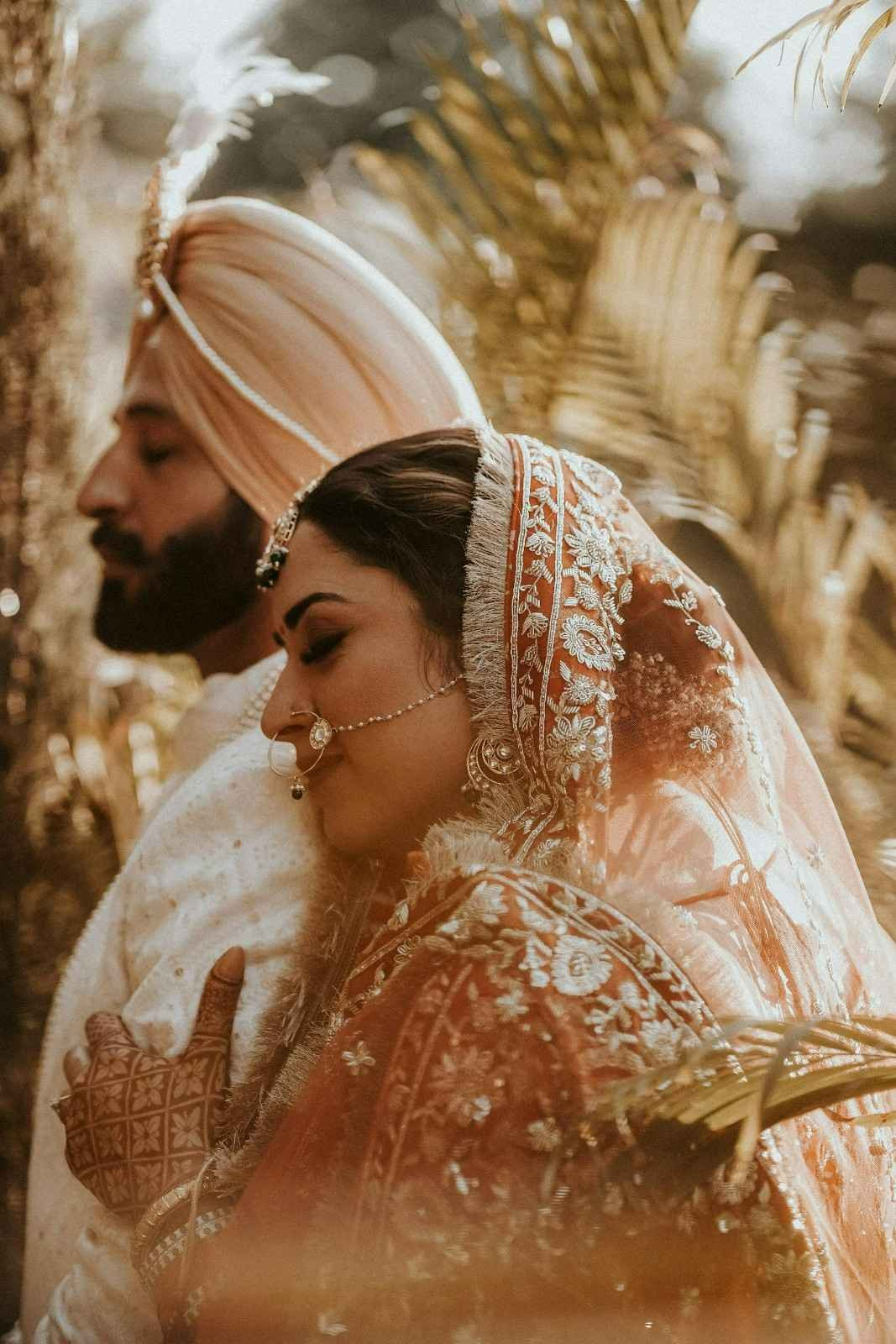 Wedding couple sharing a romantic moment during their celebration.